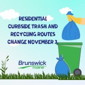 Trash being dropped into trash can.