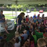 Kids Sitting in Grass